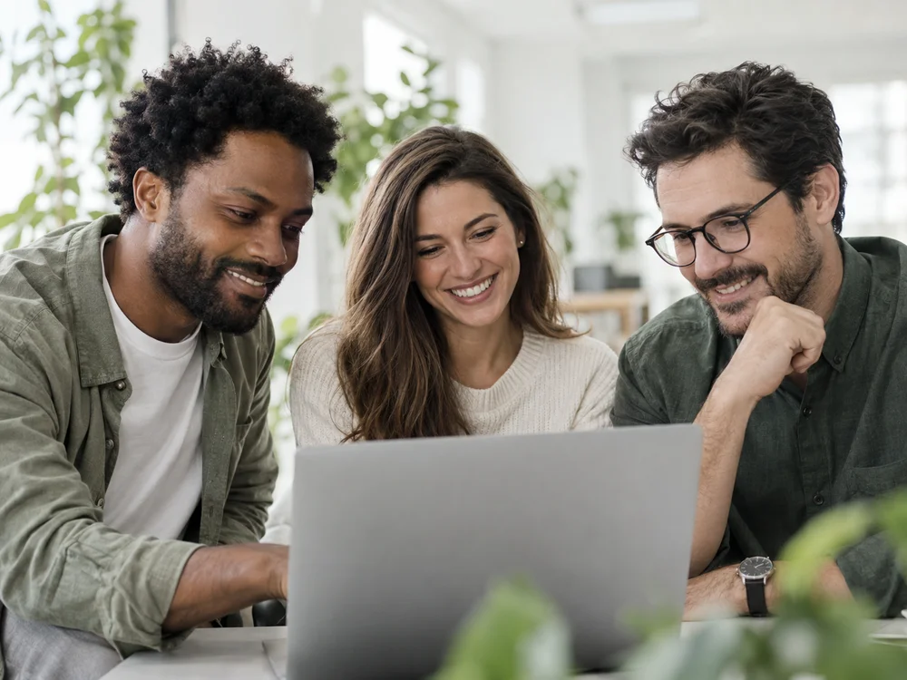 Illustration of a team collaborating around a laptop